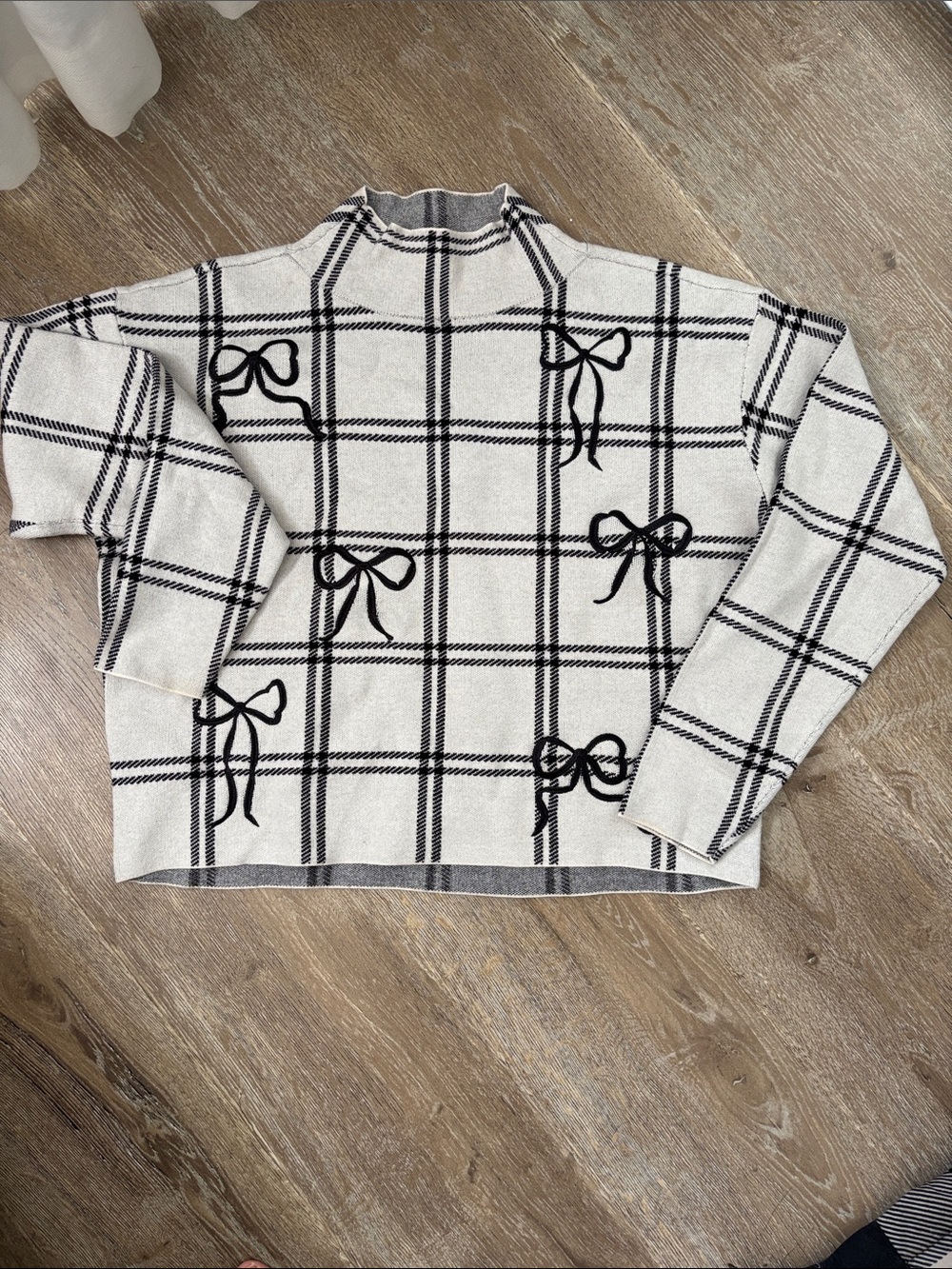 Cream Plaid Sweater with embroidered Black Bow Accents